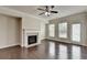 Bright living room featuring a cozy fireplace and ample natural light at 3123 Cross Creek Dr, Cumming, GA 30040