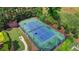 Aerial view of the community tennis court featuring nice landscaping all around the court at 3123 Cross Creek Dr, Cumming, GA 30040