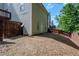 Backyard with lush green grass and privacy fence, offering a private outdoor space at 152 Stoneforest Dr, Woodstock, GA 30189