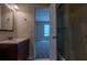Bathroom featuring a tub-shower combo with a glass door and a single sink vanity at 152 Stoneforest Dr, Woodstock, GA 30189