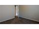 This bedroom features neutral paint, carpet flooring, a baseboard and an open door at 152 Stoneforest Dr, Woodstock, GA 30189