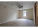 This bedroom has a ceiling fan and a window with blinds at 152 Stoneforest Dr, Woodstock, GA 30189