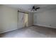 This is a bedroom with a barn door, carpet flooring, and neutral paint at 152 Stoneforest Dr, Woodstock, GA 30189