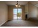 Dining area with sliding glass doors to the deck, adjacent to the living room with fireplace at 152 Stoneforest Dr, Woodstock, GA 30189