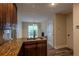 Modern kitchen featuring stainless steel appliances, granite countertops, and dark wood cabinetry at 152 Stoneforest Dr, Woodstock, GA 30189
