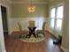 Cozy dining area with stylish lighting, hardwood floors, and a view of the outdoors at 1527 Princeton Ave, College Park, GA 30337