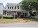 Charming two-story home with a well-maintained front yard, inviting entrance and mature trees at 1527 Princeton Ave, College Park, GA 30337