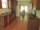 Modern kitchen featuring dark countertops, stainless steel appliances, and hardwood flooring at 1527 Princeton Ave, College Park, GA 30337