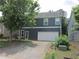 Home exterior featuring two-car garage and backyard at 1527 Princeton Ave, College Park, GA 30337