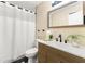The bathroom features a toilet, a sink with cabinet and a mirror at 256 Grist Mill Ln, Lawrenceville, GA 30046