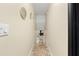 Hallway leading to living room with hardwood floors and neutral paint at 256 Grist Mill Ln, Lawrenceville, GA 30046