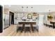 Open concept kitchen with center island and seating, stainless appliances and dining area at 256 Grist Mill Ln, Lawrenceville, GA 30046