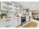 Modern kitchen with stainless appliances, marble countertops, and shaker cabinets at 256 Grist Mill Ln, Lawrenceville, GA 30046