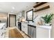 Bright kitchen featuring stainless steel appliances, quartz counters, and modern fixtures at 256 Grist Mill Ln, Lawrenceville, GA 30046