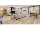 Bright living room with fireplace, large windows, and hardwood floors at 256 Grist Mill Ln, Lawrenceville, GA 30046