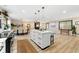 Bright and airy living space with a large kitchen island, dining area, and comfortable seating area at 256 Grist Mill Ln, Lawrenceville, GA 30046