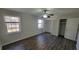 A well-lit bedroom with hardwood floors, a ceiling fan, a window, and a closet at 2825 Northeast Ne Expy # F3, Atlanta, GA 30345