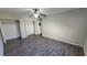 A bedroom with wood floors, a ceiling fan, a closet, and neutral-colored walls at 2825 Northeast Ne Expy # F3, Atlanta, GA 30345