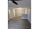 Living room with wood floors, modern light fixture and neutral paint provides for an inviting atmosphere at 3201 Fairington Dr, Lithonia, GA 30038