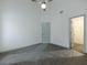 Bright bedroom with high ceiling, ceiling fan, and closet with open door; ready for new carpet at 1265 Watercrest Cir, Lawrenceville, GA 30043