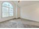 Bright bedroom with high ceiling and large arched window providing ample natural light at 1265 Watercrest Cir, Lawrenceville, GA 30043