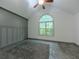 Bedroom offers vaulted ceilings, large window and stylish gray wall paneling at 1265 Watercrest Cir, Lawrenceville, GA 30043