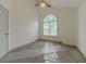 Bright bedroom with high ceiling and large arched window providing ample natural light at 1265 Watercrest Cir, Lawrenceville, GA 30043