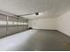 Spacious two-car garage with epoxy floor and automatic door opener; ready for your vehicles and storage needs at 1265 Watercrest Cir, Lawrenceville, GA 30043