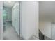 Hallway featuring new carpet, doors, and railing leading upstairs at 1265 Watercrest Cir, Lawrenceville, GA 30043
