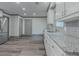 Spacious kitchen with granite countertops, stainless appliances, and wood-look flooring at 1265 Watercrest Cir, Lawrenceville, GA 30043