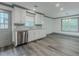 Modern kitchen features stainless steel appliances, granite countertops, and stylish gray backsplash at 1265 Watercrest Cir, Lawrenceville, GA 30043