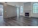 Bright living room with gray floors, decorative fireplace, and an open layout at 1265 Watercrest Cir, Lawrenceville, GA 30043