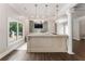 Entertaining bar area with stylish pendant lights, modern finishes, and sleek design at 330 Broad Leaf Ct, Johns Creek, GA 30022