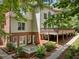 Finished basement with a patio area and lush landscaping at 330 Broad Leaf Ct, Johns Creek, GA 30022