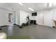Basement workout area with exercise equipment and door leading to outdoors at 330 Broad Leaf Ct, Johns Creek, GA 30022