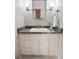 Bathroom vanity featuring a white sink, gray marble countertop, and ample storage space for toiletries and essentials at 330 Broad Leaf Ct, Johns Creek, GA 30022
