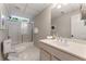 Cozy bathroom with a glass-enclosed shower, vanity, and bright fixtures at 330 Broad Leaf Ct, Johns Creek, GA 30022
