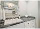 Bathroom featuring a vanity with granite countertop, white cabinets, and a sink with chrome fixtures at 330 Broad Leaf Ct, Johns Creek, GA 30022