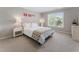 Comfortable bedroom with neutral walls, plush carpeting, and a large window offering natural light at 330 Broad Leaf Ct, Johns Creek, GA 30022