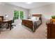 Cozy bedroom featuring natural light, wood desk, and decorative furnishings for a comfortable atmosphere at 330 Broad Leaf Ct, Johns Creek, GA 30022