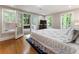 Comfortable bedroom with access to an outdoor area and a private view at 330 Broad Leaf Ct, Johns Creek, GA 30022