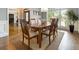 Formal dining room with hardwood floors, a large window, and elegant dining set at 330 Broad Leaf Ct, Johns Creek, GA 30022