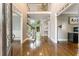 Grand foyer showcasing hardwood floors, soaring ceilings, and a staircase with metal spindles at 330 Broad Leaf Ct, Johns Creek, GA 30022