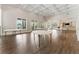 Spacious great room featuring wood floors, lots of natural light, and access to outdoor patio at 330 Broad Leaf Ct, Johns Creek, GA 30022