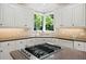 Kitchen featuring white cabinets, granite countertops and stainless appliances at 330 Broad Leaf Ct, Johns Creek, GA 30022