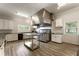 Commercial kitchen with stainless steel appliances, ample counter space, and abundant storage at 330 Broad Leaf Ct, Johns Creek, GA 30022