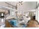 Spacious living room with hardwood floors, fireplace, access to the kitchen and staircase to the second level at 330 Broad Leaf Ct, Johns Creek, GA 30022