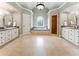 Spacious bathroom featuring dual vanities, soaking tub under arched window and a separate walk-in shower at 330 Broad Leaf Ct, Johns Creek, GA 30022