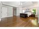 Spacious main bedroom boasts hardwood floors, seating area, and large windows with outdoor views at 330 Broad Leaf Ct, Johns Creek, GA 30022