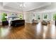 Spacious main bedroom boasts hardwood floors, seating area, and large windows with outdoor views at 330 Broad Leaf Ct, Johns Creek, GA 30022